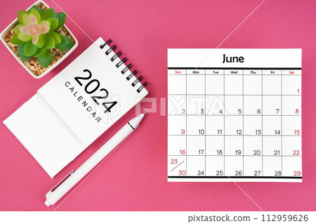 White calendar for June 2024 and pen on pink color background. White calendar for June 2024 and pen on pink color background. 112959626