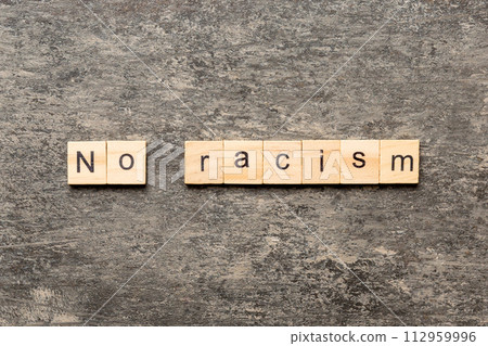 No racism word written on wood block. No racism text on table, concept No racism word written on wood block. No racism text on table, concept 112959996