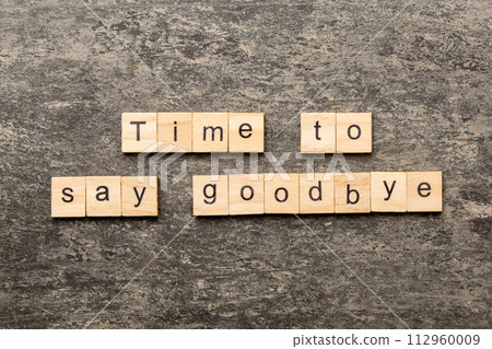 Time to say goodbye word written on wood block. Time to say goodbye text on table for your desing, concept 112960009