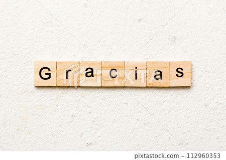 gracias word written on wood block. gracias text on table, concept gracias word written on wood block. gracias text on table, concept 112960353