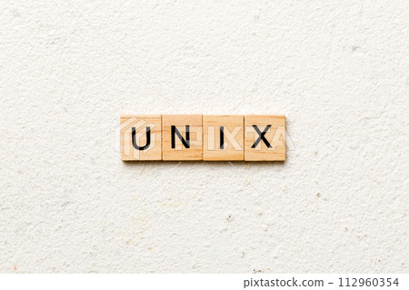 Unix word written on wood block. Unix text on table, concept 112960354