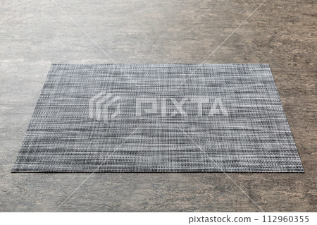 Perspective view of tablecloth for food on cement background. Empty space for your design 112960355