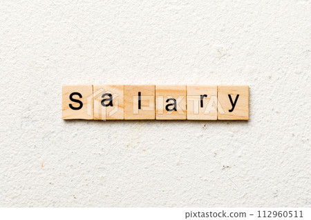 salary word written on wood block. salary text on table, concept 112960511