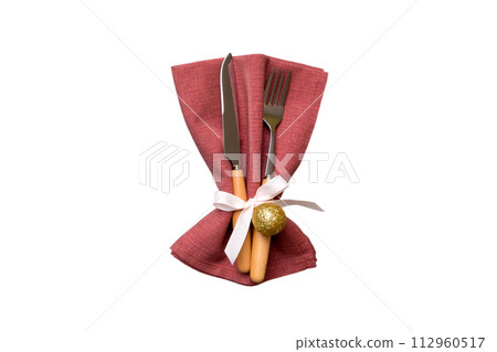 isolated christmas Plate with decor and fork and spoon. New year holiday background. Top view isolated christmas Plate with decor and fork and spoon. New year holiday background. Top view 112960517