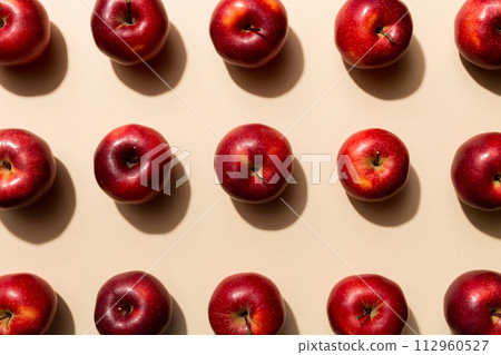 Many red apples on colored background, top view. Autumn pattern with fresh apple above view 112960527