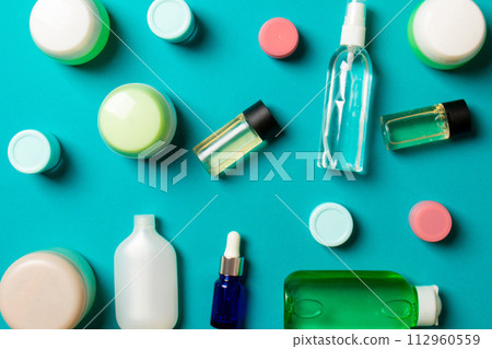 Group of plastic bodycare bottle Flat lay composition with cosmetic products on colored background empty space for you design. Set of White Cosmetic containers, top view with copy space Group of plastic bodycare bottle Flat lay composition with cosmetic products on colored background empty space for you design. Set of White Cosmetic containers, top view with copy space 112960559