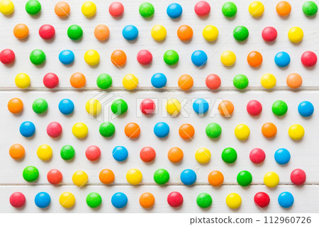 colorful candies as background top view. Seamless pattern with candy. Many sweet candies close-up colorful candies as background top view. Seamless pattern with candy. Many sweet candies close-up 112960726