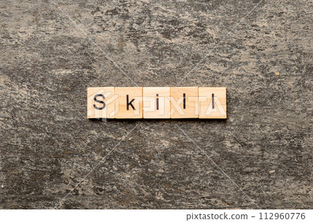 Skill word written on wood block. Skill text on cement table for your desing, concept 112960776