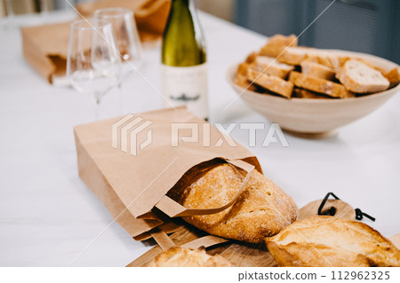 Ciriola Romana Bread on Wooden Serving Board Ciriola Romana Bread on Wooden Serving Board 112962325