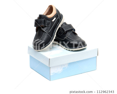 Children's shoes on the box Children's shoes on the box 112962343