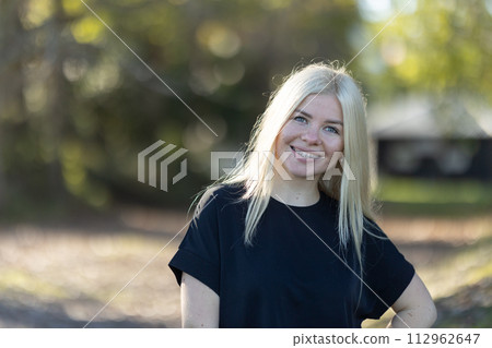 Happy Woman with braces With Blonde Hair in Park 112962647