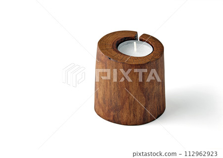 Cracked sawn wood candle holder and pillar candles isolated on a white background 112962923