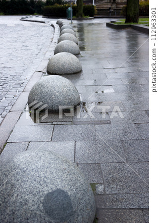 Street of granite stones in the old town, and hemisphere 112963301