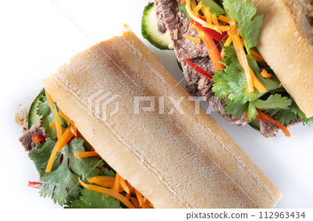 Vietnamese banh mi sandwich isolated on white background Vietnamese banh mi sandwich isolated on white background 112963434