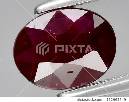 natural red ruby corrundum gemstone on the background natural red ruby corrundum gemstone on the background 112963549