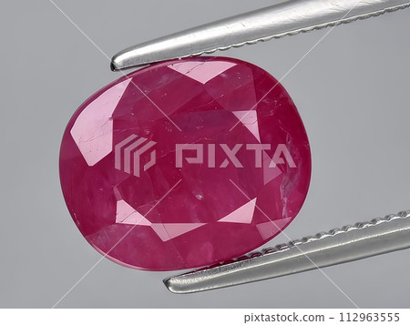 natural red ruby corrundum gemstone on the background natural red ruby corrundum gemstone on the background 112963555