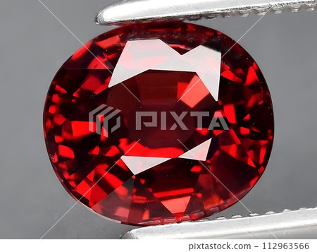 natural red rhodolite garnet gemstone on the background 112963566