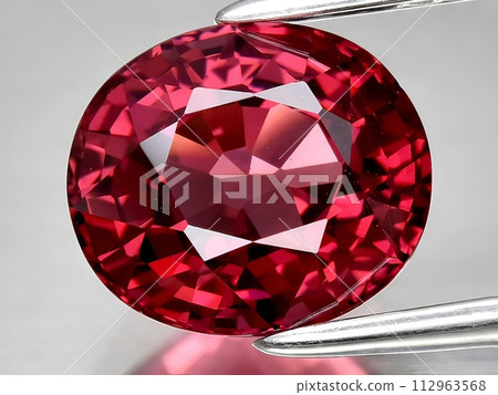natural red rhodolite garnet gemstone on the background 112963568