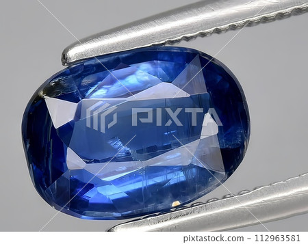 natural blue kyanite gemstone on the background natural blue kyanite gemstone on the background 112963581