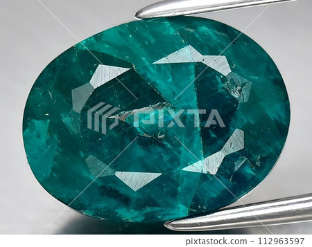 natural green dioptase gemstone on the background 112963597