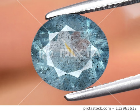 natural blue aquamarine gemstone on the background natural blue aquamarine gemstone on the background 112963612