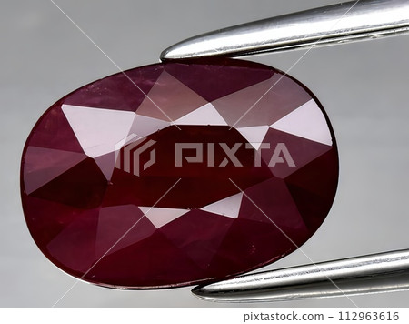 natural red ruby corrundum gemstone on the background natural red ruby corrundum gemstone on the background 112963616