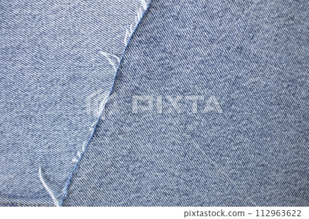 Light blue denim texture or denim background with thread, textile material 112963622