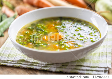 Healthy vegetable soup from fresh spring vegetables 112963665