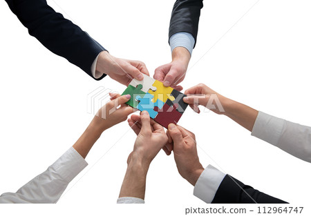 businessmen working together to build a puzzle as teamwork, partnership and integration concept 112964747