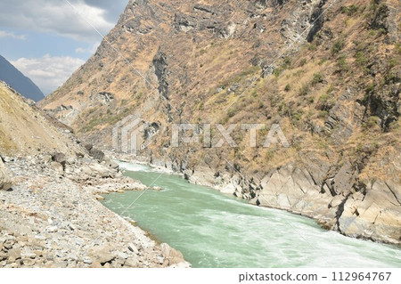 river flowing from mountain of tiger leaping Gorge travel location in China 112964767