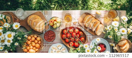 Top view of the table with different fruits, vegetables and snacks on it. Picnic concept. 112965517