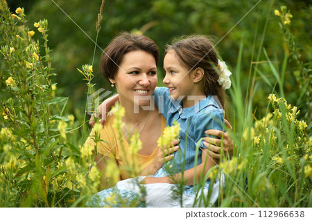 Portrait of mother and daughter in park Portrait of mother and daughter in park 112966638