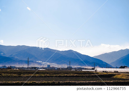 Yamagata Village in spring with sand from the potato fields seen from Matsumoto City 112966735