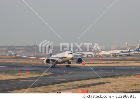 Passenger plane taking off, front view Passenger plane taking off, front view 112966913