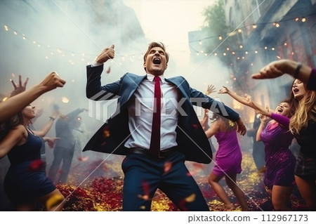 A cool man in sunglasses and tie gestures to crowd 112967173