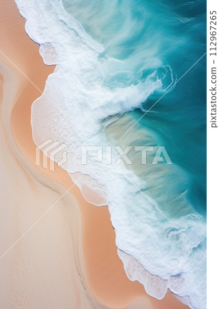 Water waves crashing on sandy shore, azure blue white and yellow hues 112967265