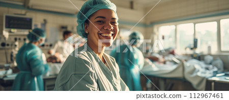 Happy doctor in lab coat in the hospital. Health care and assistance concept. 112967461