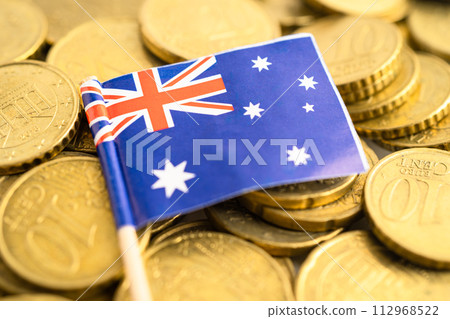 Australia flag on coins money, finance and accounting, banking concept. Australia flag on coins money, finance and accounting, banking concept. 112968522