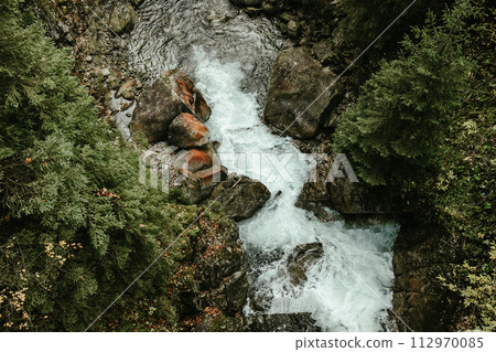 Wild river waterfall in mountain forest Wild river waterfall in mountain forest 112970085
