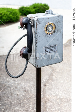 Soviet pay phone, a coin-operated public telephone. Text in russian Soviet pay phone, a coin-operated public telephone. Text in russian 112970290
