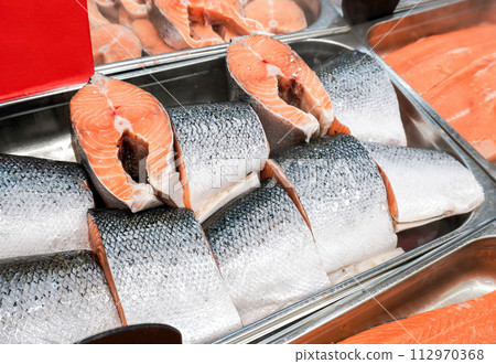Steaks of fresh salmon fish on the counter Steaks of fresh salmon fish on the counter 112970368