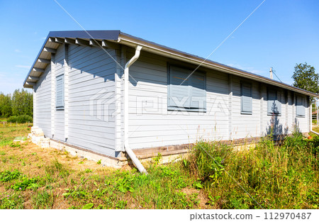 New finnish rustic wooden home in summer sunny day 112970487