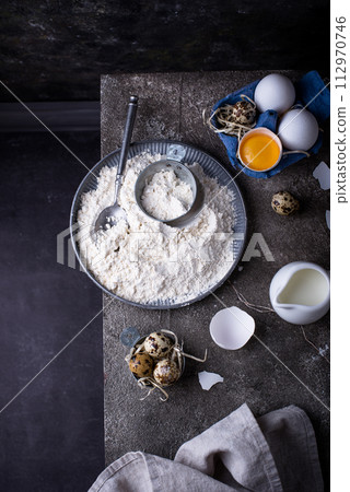 Baking ingredients with flour and eggs 112970746