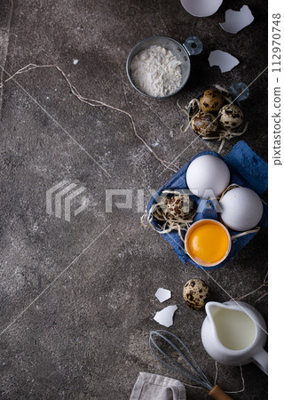 Baking ingredients with flour and eggs Baking ingredients with flour and eggs 112970748