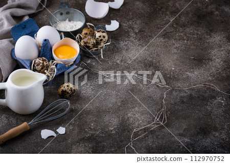 Baking ingredients with flour and eggs 112970752
