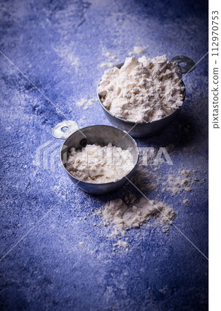 Wheat flour on dark. Baking background Wheat flour on dark. Baking background 112970753