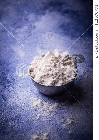 Wheat flour on dark. Baking background Wheat flour on dark. Baking background 112970771