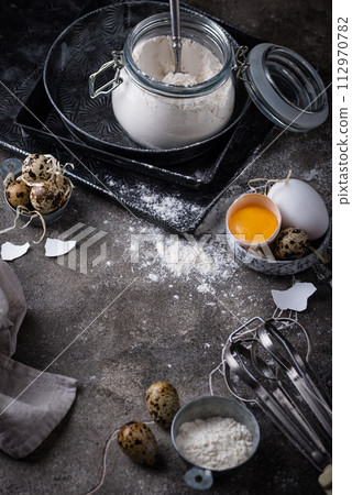 Baking ingredients with flour and eggs 112970782