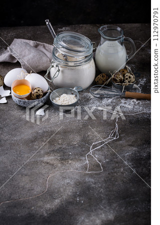 Baking ingredients with flour and eggs 112970791