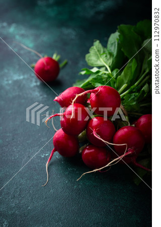 Fresh organic radish on green background 112970832